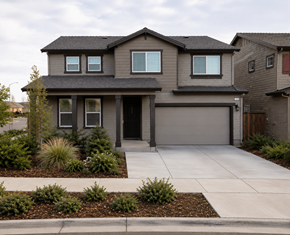 Chico apartment for rent - A modern house with a grey garage door and a black roof.