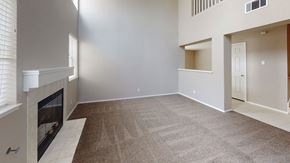 Vacaville apartment for rent - A living room with a fireplace and carpeted floor.