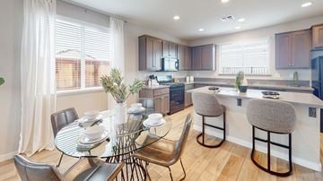 Fairfield apartment for rent - A modern kitchen with a dining table set for two.