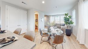 Fairfield apartment for rent - A dining room with a table set for two and a potted plant on the side table.