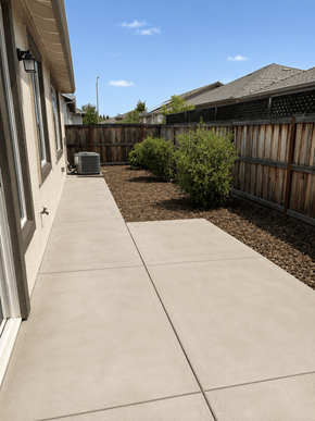 Chico apartment for rent - A concrete walkway leads to a wooden fence.