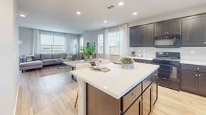 Fairfield apartment for rent - A modern kitchen with a white island and black cabinets.