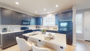 Fairfield apartment for rent - A modern kitchen with dark brown cabinets and a white island.