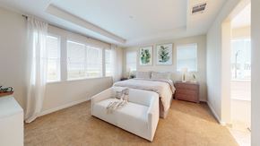 Fairfield apartment for rent - A bedroom with a large bed and a window with curtains.