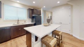 Fairfield apartment for rent - A kitchen with a white table and brown chairs.