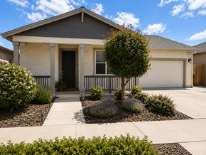 Chico house for rent - A house with a grey roof and a white garage door.