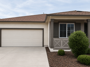 Chico house for rent - A house with a white garage door and a grey window.