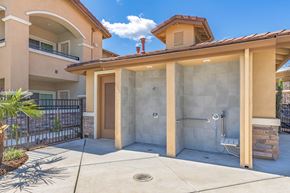 Chico apartment for rent - a walk in shower in front of a house with a patio at Heritage Landing Apartments, Chico, CA