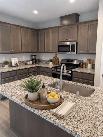 Chico house for rent - A kitchen with granite countertops and a sink.