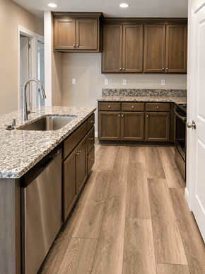 Chico apartment for rent - A kitchen with wooden cabinets and a granite countertop.