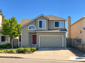 Suisun City house for rent - A house with a red door and a garage door.