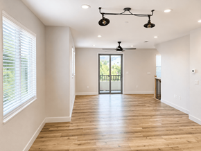 Martinez townhouse for rent - A room with a sliding glass door and a ceiling fan.