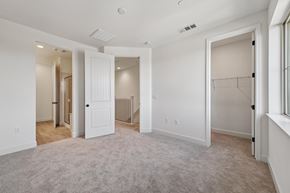 Martinez townhouse for rent - A spacious room with white walls and a carpeted floor.