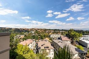 Martinez townhouse for rent - A view of a residential area with houses and trees.
