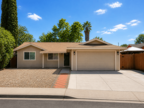Vacaville apartment for rent - A house with a garage and a driveway in front of it.