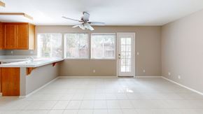 Vacaville apartment for rent - A kitchen with a fan on the ceiling and a countertop.