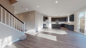 Chico apartment for rent - A spacious, well-lit kitchen and living room with hardwood floors and a staircase on the left.