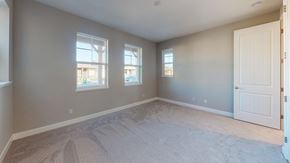 Chico apartment for rent - A room with a carpeted floor and a door on the right side.