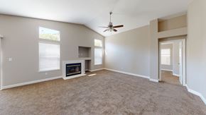 Bay Point apartment for rent - A living room with a fireplace and a ceiling fan.