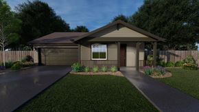 Chico apartment for rent - A house with a brown roof and a garage is surrounded by a well-manicured lawn and a sidewalk.