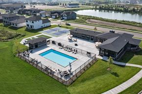 Rochester apartment for rent - A large house with a pool in the backyard.