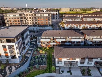 Calgary apartment for rent - A modern residential complex with a mix of apartment buildings and townhouses.