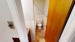 Fredericton apartment for rent - A white toilet is in a small bathroom.