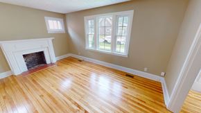 Fredericton apartment for rent - A room with a fireplace and a window.