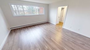 Fredericton apartment for rent - A room with a window and a door.