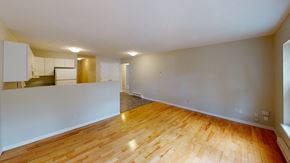 Fredericton apartment for rent - A room with wooden floors and white walls.