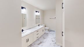 Fredericton apartment for rent - A bathroom with a marble floor and white walls.