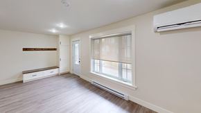 Fredericton apartment for rent - A room with a window and a bench under a window.