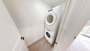 Fredericton apartment for rent - A white washing machine is in a small room.