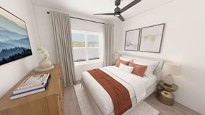 Fredericton apartment for rent - A bedroom with a large bed and a ceiling fan.