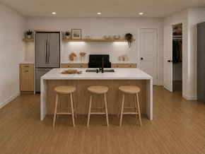 Fredericton apartment for rent - A kitchen with a white countertop and wooden stools.