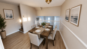 Fredericton apartment for rent - A dining room with a wooden table set for two.
