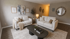 Fredericton apartment for rent - A living room with two couches, a coffee table, and a mirror.