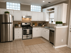 Dallas apartment for rent - A kitchen with white cabinets and a stainless steel refrigerator.