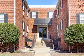 Alexandria apartment for rent - The front of a brick building with a sign that says 40th East Mornge Avenue.