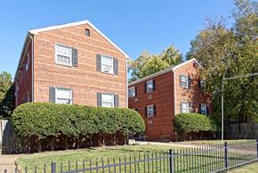 Alexandria apartment for rent - Two red brick houses with green hedges in front.