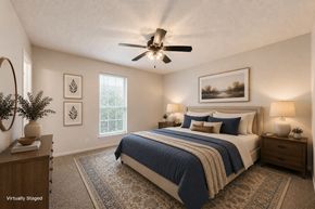 Austin apartment for rent - A bedroom with a bed, two nightstands, and a ceiling fan.