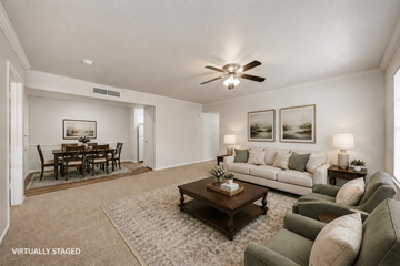 Austin apartment for rent - A living room with a brown coffee table and a white couch.