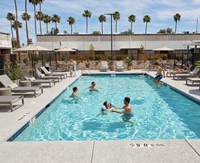 Las Vegas apartment for rent - A group of people are enjoying a swim in a pool on a sunny day.
