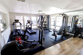 Las Vegas apartment for rent - A gym with a variety of equipment including treadmills, weights, and exercise machines.