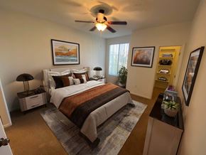 Las Vegas apartment for rent - A bedroom with a bed, nightstands, and a ceiling fan.