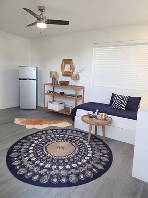 Las Vegas apartment for rent - A living room with a couch, a rug, and a ceiling fan.