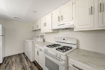 Las Vegas apartment for rent - A white kitchen with a stove and oven.