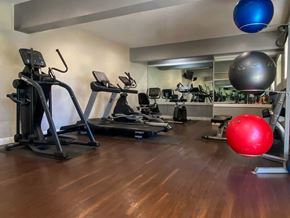 Valley Village apartment for rent - A gym with a treadmill, exercise ball, and other equipment.