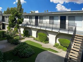 Encino apartment for rent - A white building with a balcony and a staircase.