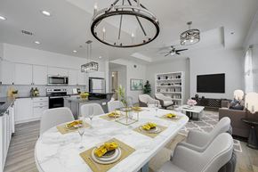 Las Vegas apartment for rent - A modern dining room with a marble table set for a meal.